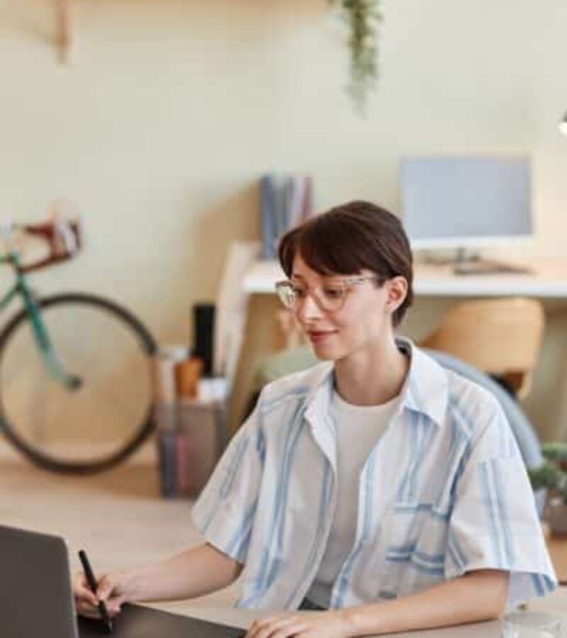 Young woman using pen tablet for digital design Young woman using pen tablet for digital design