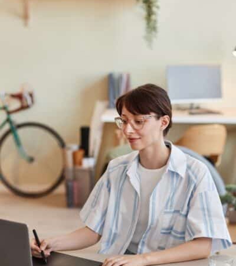 Young woman using pen tablet for digital design